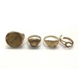 Four 9ct gold rings to include St. George medal ring, coin ring, signet ring and an initial ring (br
