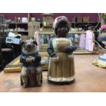 Two Austrian terracotta figural boxes, one in the form of a pig seated on a chair, marked JM for Joh