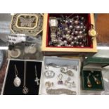 Group of costume jewellery, two wristwatches, silver pendants on chains, earrings and coins