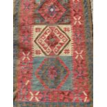 Eastern rug with geometric decoration and three central medallions, 129cm x 76cm, together with anot
