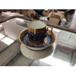 19th century Vienna porcelain coffee cup and saucer, decorated with a foliate pattern, beehive marks