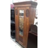 Edwardian oak single wardrobe with mirrored door and carved panels