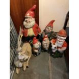 Five garden gnome ornaments with one other