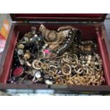 Wooden box containing gilt metal chains and other costume jewellery