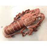 Carved orange/red hardstone crayfish, 31.5cm long