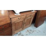 Pine sideboard with two drawers and two panelled doors below, 111.5cm wide, 58cm deep, 83cm high