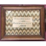 Religious needlework sampler in oak frame