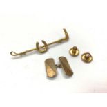 9ct gold riding crop brooch, two 9ct gold studs and one 9ct gold cufflink