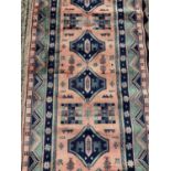 Part silk runner with geometric decoration on turquoise and peach ground, 224cm x 69.5cm