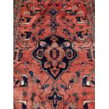 Eastern rug with geometric decoration on red and blue ground, 282cm x 160cm