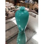 Antique turquoise glass vase with trailed foot, (turquoise glass cased over opaque glass)