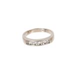 Diamond and platinum half eternity ring with a band of five round brilliant cut diamonds in platinum
