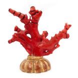 A coral objet d'art on gilt wood stand, possibly Chinese
