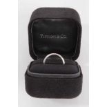 Tiffany & Co. platinum wedding ring, boxed.