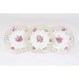 Set of three Minton plates with pierced borders and polychrome painted with floral sprays
