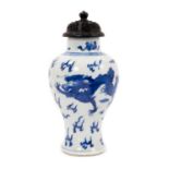 19th century Chinese porcelain blue and white baluster shape vase with a carved wooden cover