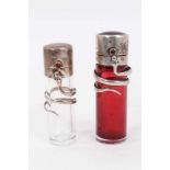 A late Victorian novelty silver snake scent bottle, cylindrical form with cabochon garnet thumbpiece