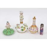Three Victorian porcelain scent bottles including a Rockingham china bottle and stopper, and a silve