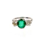 Emerald and diamond three stone ring