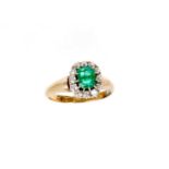 Edwardian emerald and diamond cluster ring