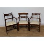 Three Regency mahogany bar back open armchairs