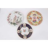 An 18th century Chelsea plate, decorated with exotic birds, together with two Worcester plates (3)