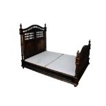 Ornate 19th century French carved chestnut double bed, with bobbin turned arched head and footboard