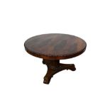 William IV rosewood circular breakfast table, the tilt top with beaded edge on facetted column and s