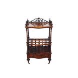 Victorian walnut canterbury whatnot, of serpentine form with pierced gallery and shelf raised on spi