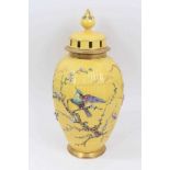 Continental yellow ground vase with raised polychrome painted bird and flower decoration. Sunburst 5