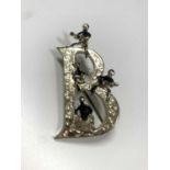 1960s Beatles brooch by Exquisite, the larger capital B decorated with musical notes