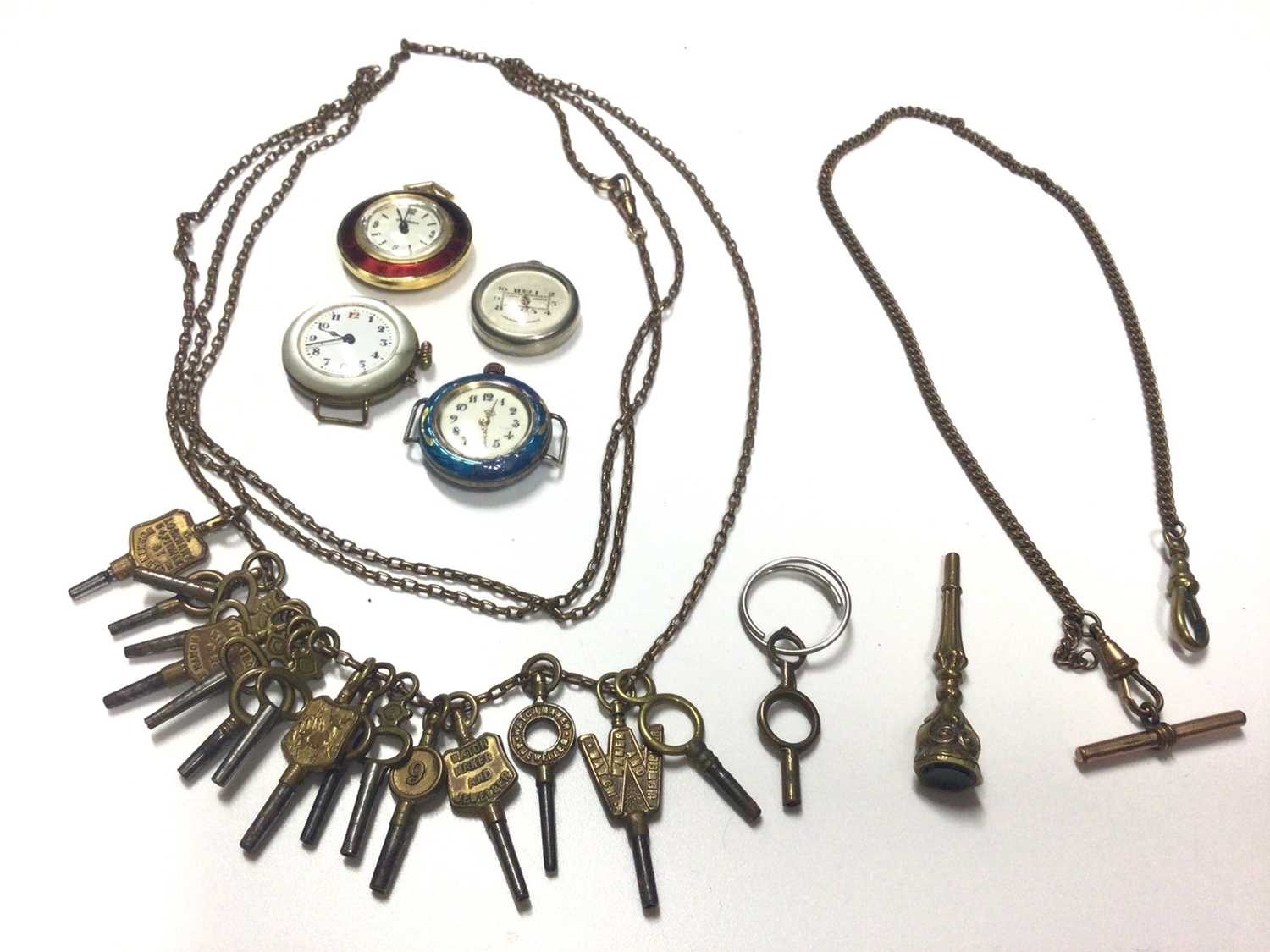 Collection of watching winding keys on long chain, one other watch chain, seal/fob key, vintage silv