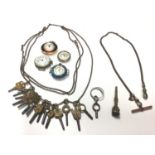 Collection of watching winding keys on long chain, one other watch chain, seal/fob key, vintage silv
