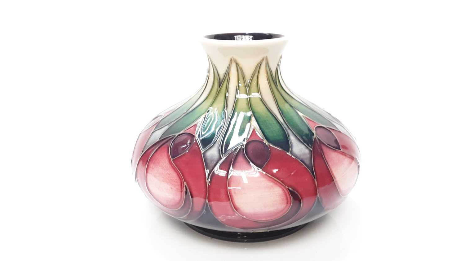 Moorcroft pottery squat vase decorated in the Tulip pattern, dated 2002, 11cm high, boxed