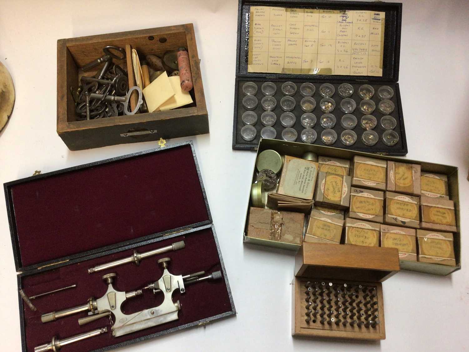 Four boxes of watchmaking equipment, including lathes, watch faces, etc - Image 10 of 14