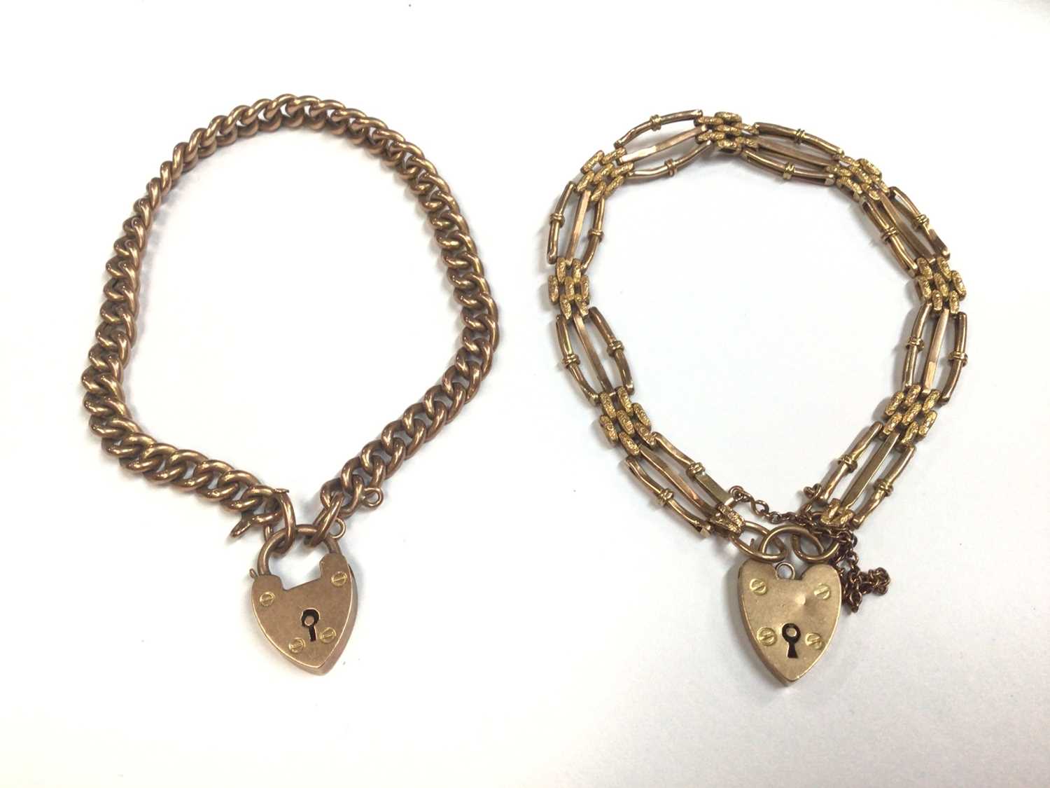 Two 9ct gold bracelets, both with padlock clasps