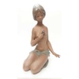 Large Lladro figure of a semi clad female holding a flower, impressed marks to base, numbered 3517,