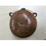 19th century spirit flask made from a gourd with metal mounted cork and woven suspension loops, the