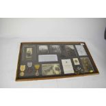 First World War display mounted in glazed frame, containing piece of Zeppelin L32, shot down near Bi