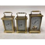 Group of brass and white metal cased carriage clocks, and an unusual brass clockwork bell