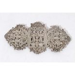 Thai white metal buckle with figure and foliate scroll pierced decoration