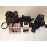 Pentax camera, Sony camcorder, two pairs of binoculars and similar