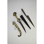 19th century Arab jambia dagger in white metal and brass sheath, another eastern dagger with coral h