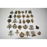 Collection of thirty military cap badges to include Royal Flying Corps, Royal Scots Greys and Life G