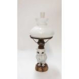 Late 19th century Dresden porcelain owl oil lamp with glass eyes and opaque glass shade