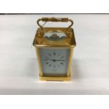 A brass cased carriage clock retailed by Dent, with Paris movement, 17cm high with handle up