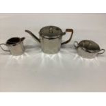 W.M.F. silver plated three piece teaset comprising teapot with wicker covered handle, together with