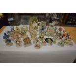 Large collection of Staffordshire cottages and figures