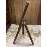 Victorian-style brass telescope on tripod stand