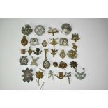 Collection of thirty military cap badges to include Scottish Horse, Highland Regiment and Royal Scot